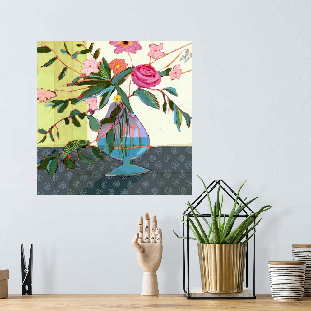 A bohemian room featuring This whimsical artwork features dazzling flowers arranged energetically in a blue vase over a pat...