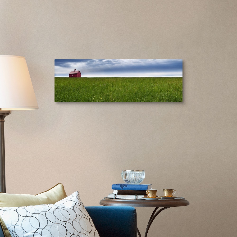 A traditional room featuring Panoramic photograph of a rural landscape with a wide open green field, red barn, and a blue clou...