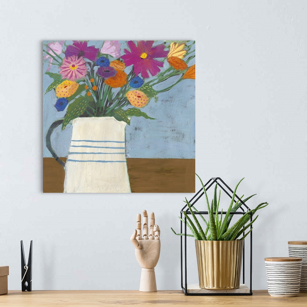 A bohemian room featuring Folk art painting of bouquet of flowers in a farmhouse pitcher.