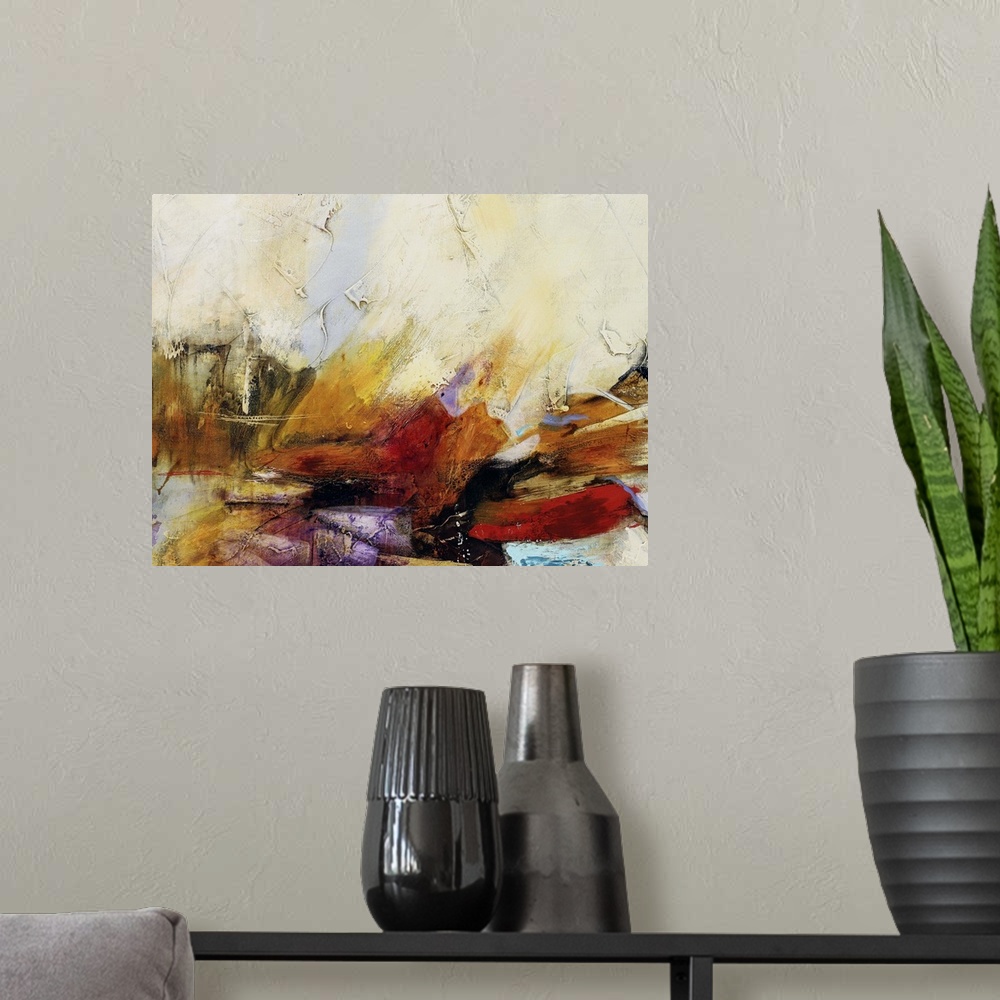 A modern room featuring Horizontal abstract painting in tones of yellow, orange and red with textured cream accents.