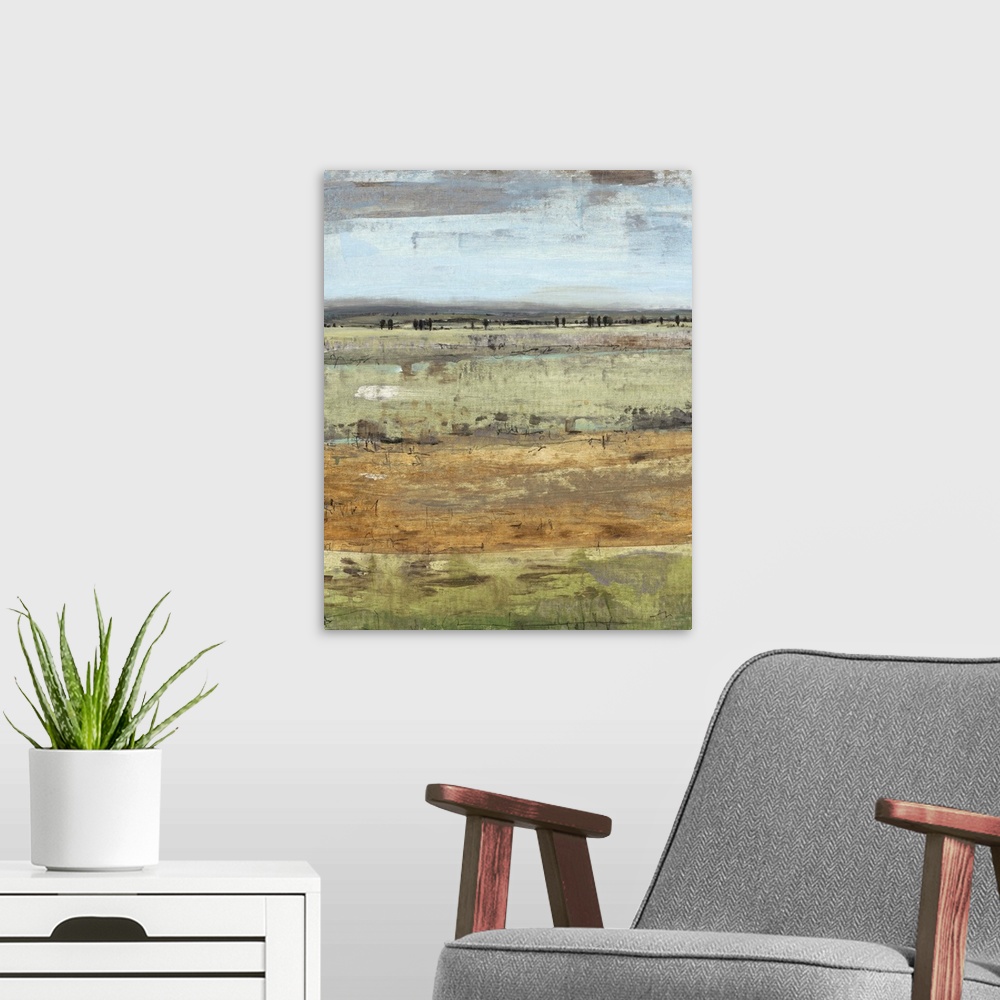 A modern room featuring Contemporary painting of an open field under a pale grey sky.
