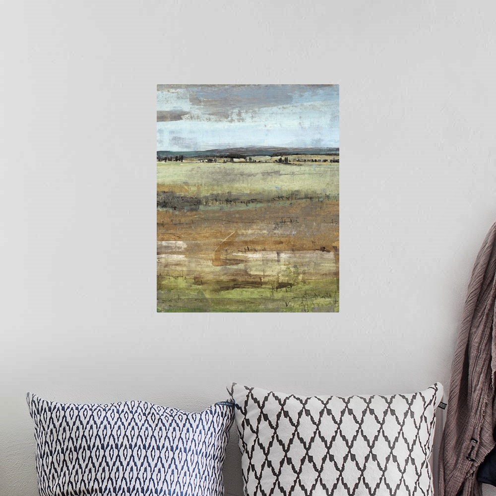 A bohemian room featuring Contemporary painting of an open field under a pale grey sky.