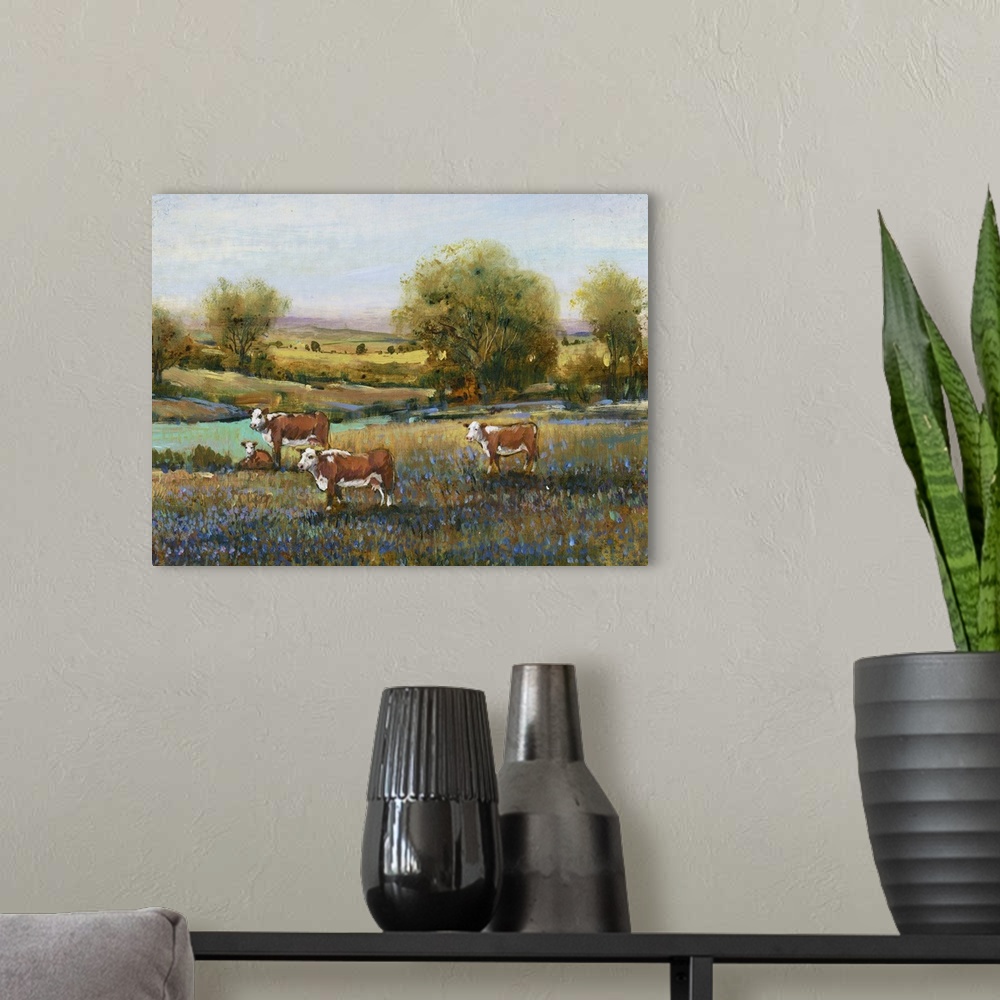 A modern room featuring Contemporary artwork of a calm countryside filled with grazing cows and blue flowers created with...