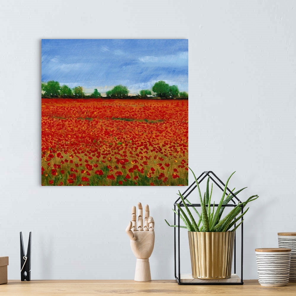 A bohemian room featuring Contemporary painting of a field of red poppies under a blue sky.