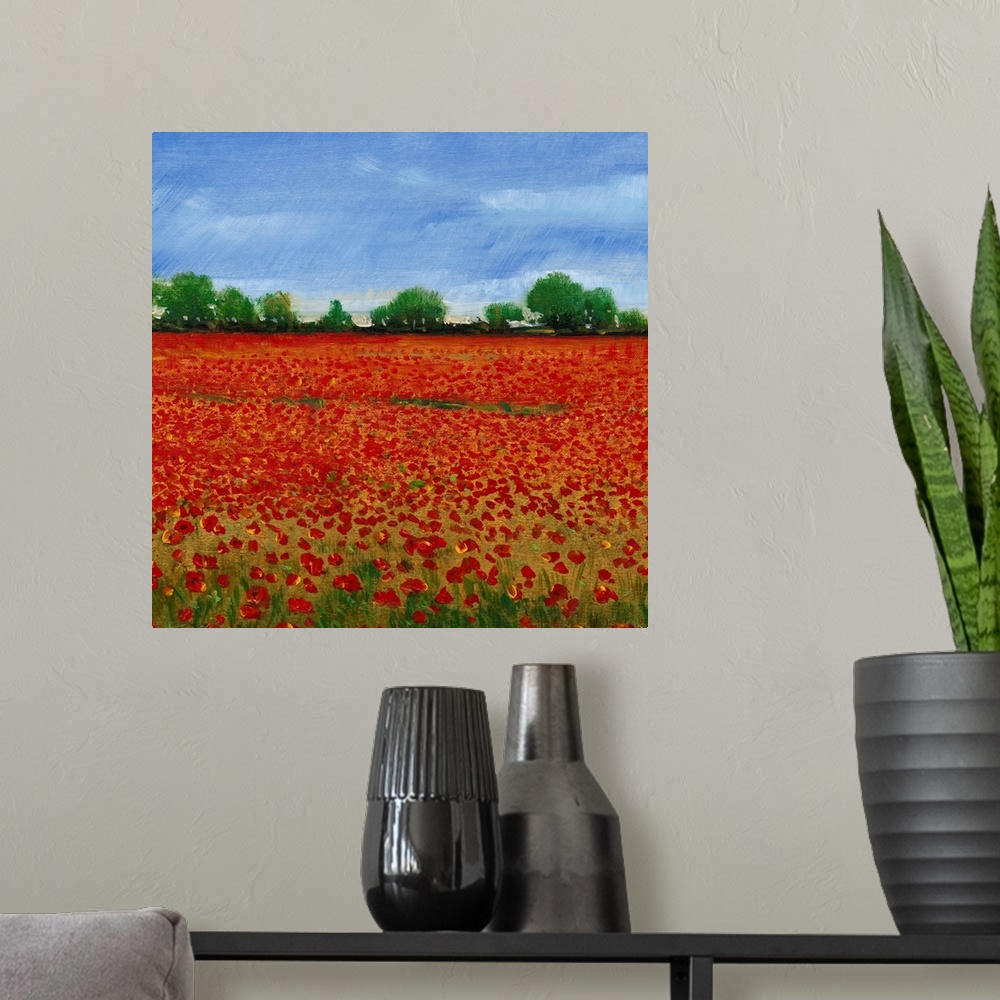 A modern room featuring Contemporary painting of a field of red poppies under a blue sky.