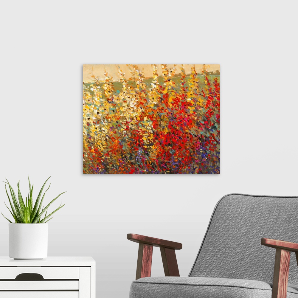 A modern room featuring A glorious tangle of wildflowers in warm yellow and red tones. This modern painting in the impres...