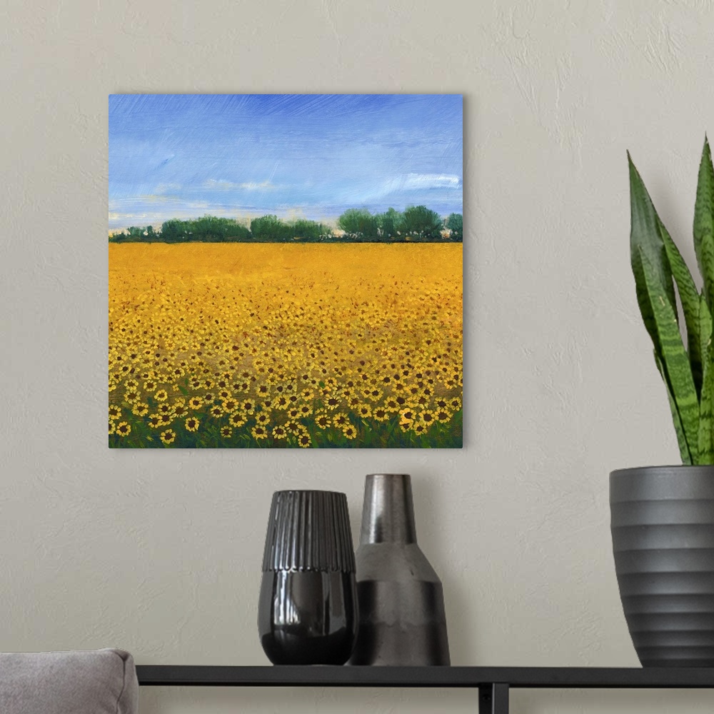 A modern room featuring Contemporary painting of a field of yellow sunflowers under a blue sky.