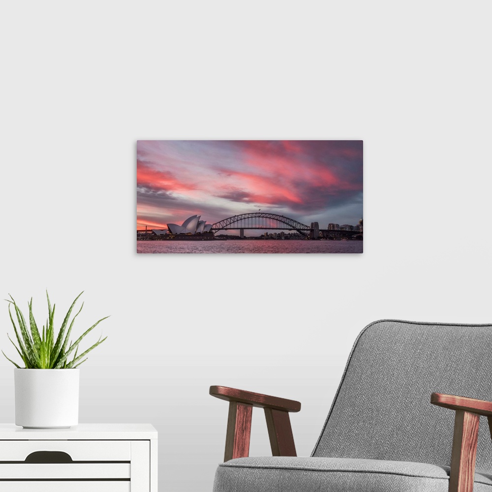 A modern room featuring Panoramic photograph of the Harbor Bridge in Sydney, Australia at sunset.