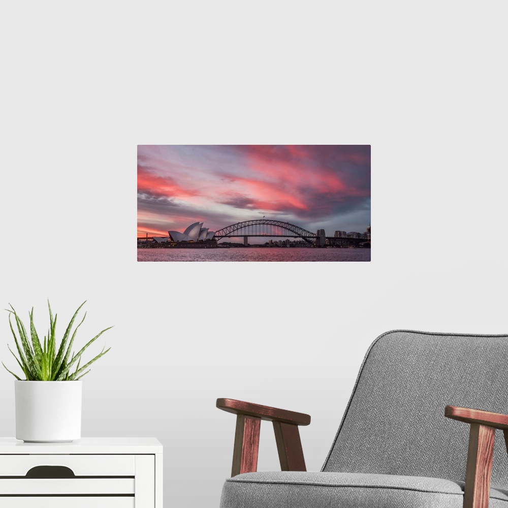 A modern room featuring Panoramic photograph of the Harbor Bridge in Sydney, Australia at sunset.