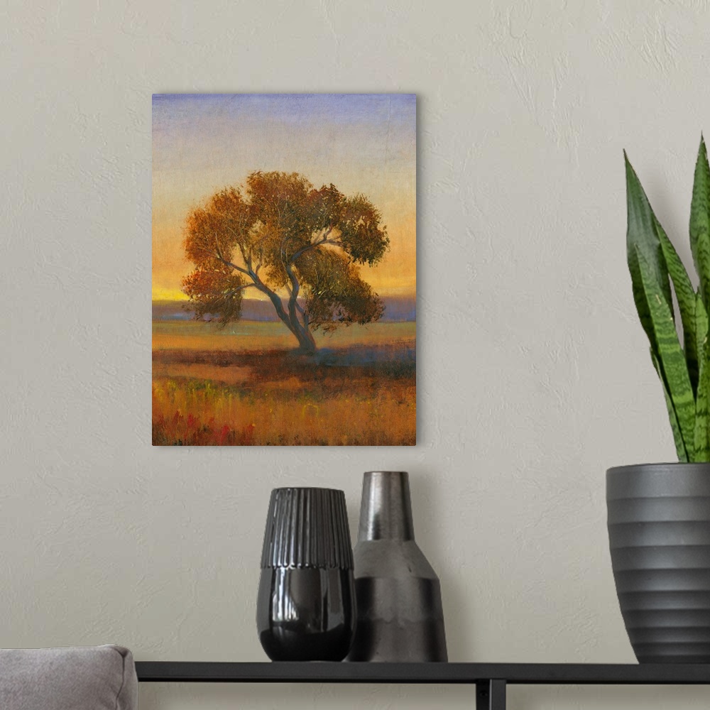 A modern room featuring Contemporary landscape painting of a lone tree in a meadow at sunset.