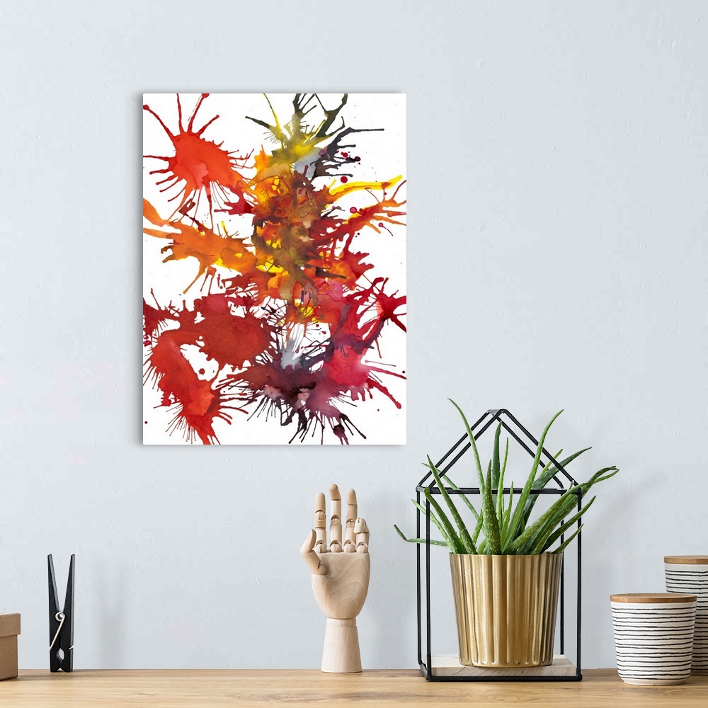 A bohemian room featuring Abstract painting of splattered paint in deep red and orange, resembling fireworks.