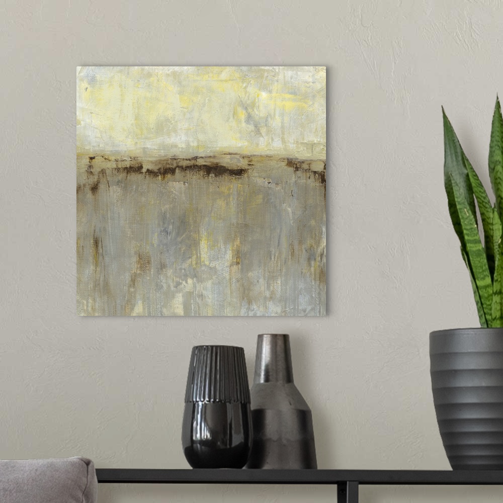 A modern room featuring Contemporary abstract painting using gray tones and split contrasting colors.