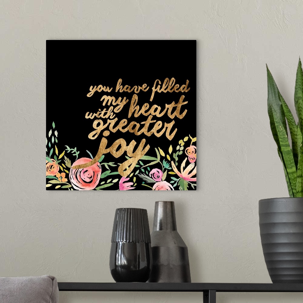 A modern room featuring This decorative artwork features the words: You have filled my heart with greater joy, in gold co...