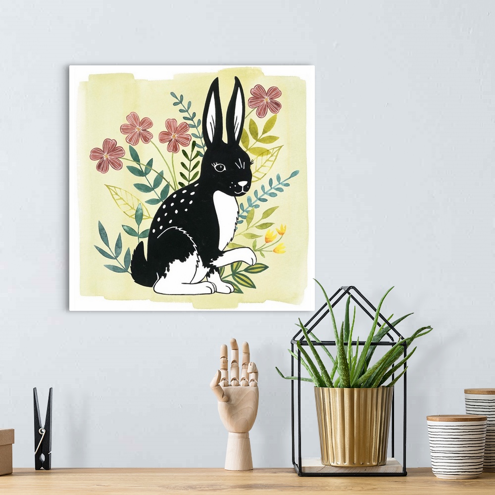 A bohemian room featuring A square decorative design of a black and white rabbit surrounded by flowers on a pale yellow bac...