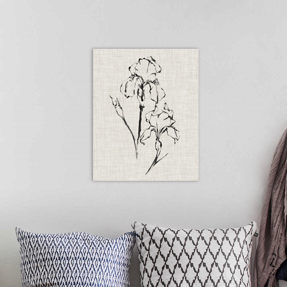 A bohemian room featuring A black ink drawing of a flower against of beige linen background.