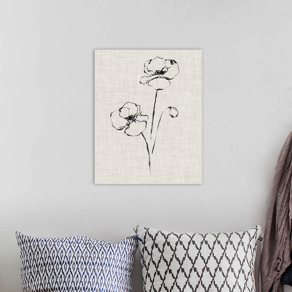 A bohemian room featuring A black ink drawing of a flower against of beige linen background.