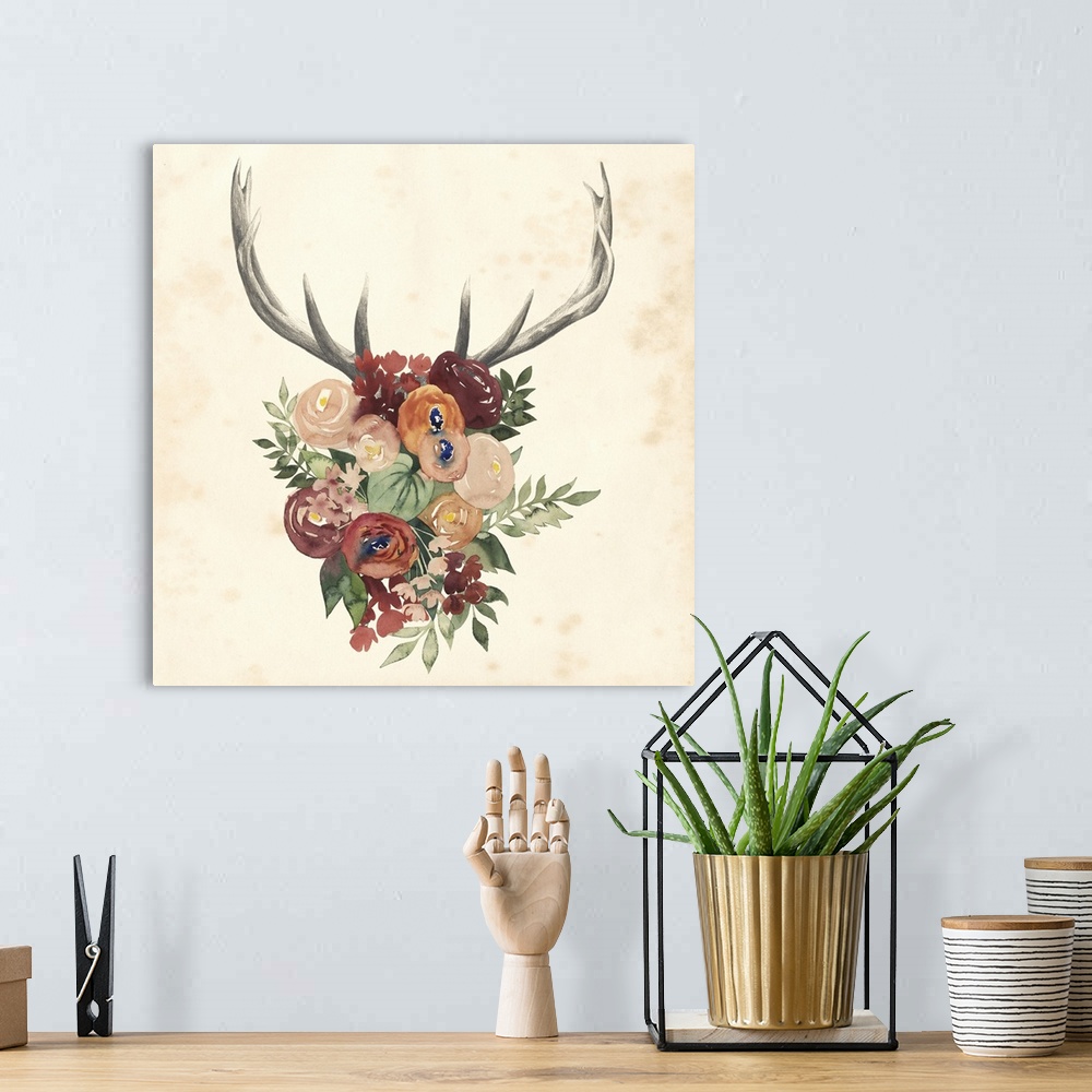A bohemian room featuring Artwork of a bouquet of flowers with deer antlers.