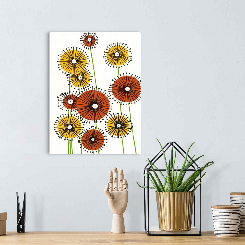 A bohemian room featuring Vertical painting of circular yellow and orange flowers on a white background.