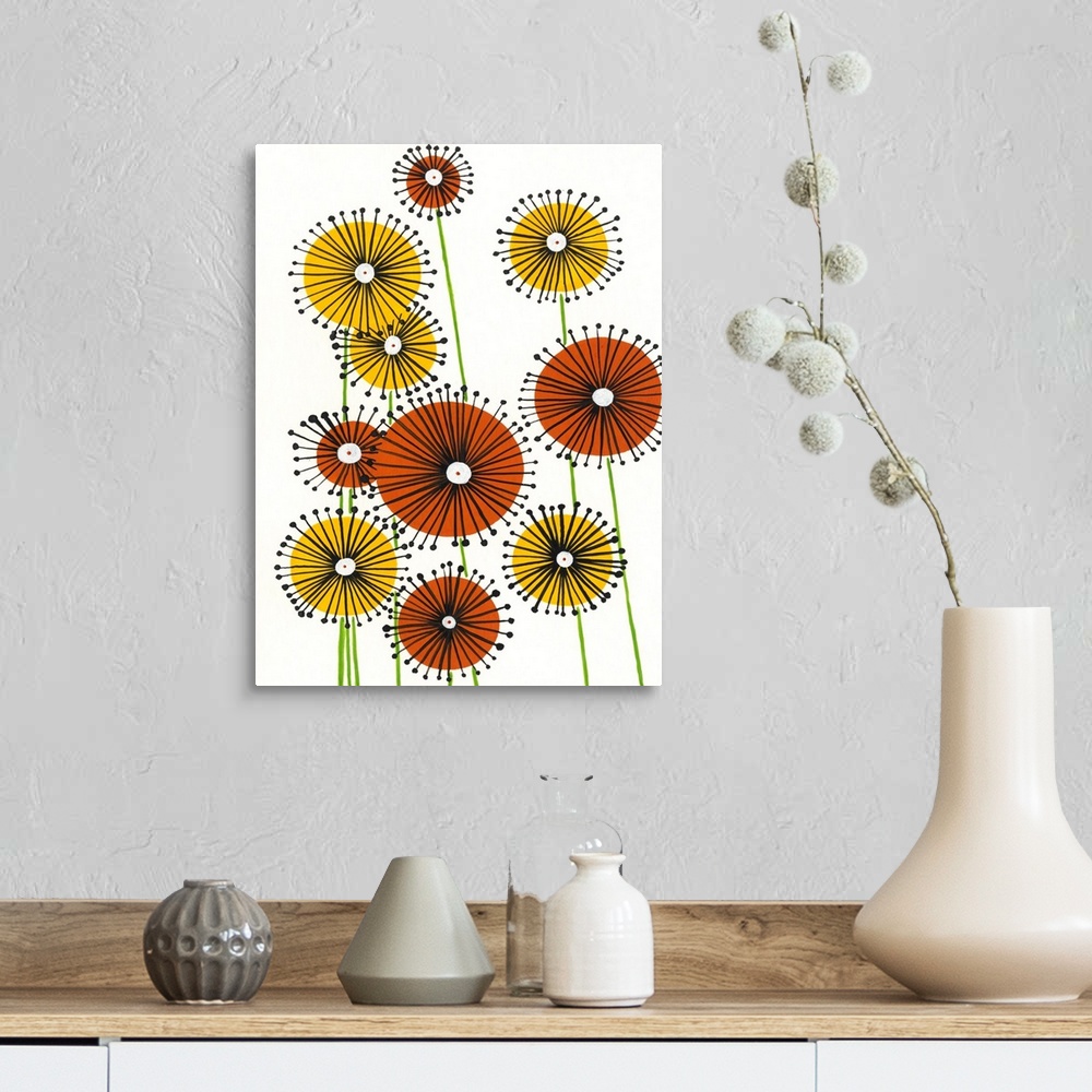A farmhouse room featuring Vertical painting of circular yellow and orange flowers on a white background.