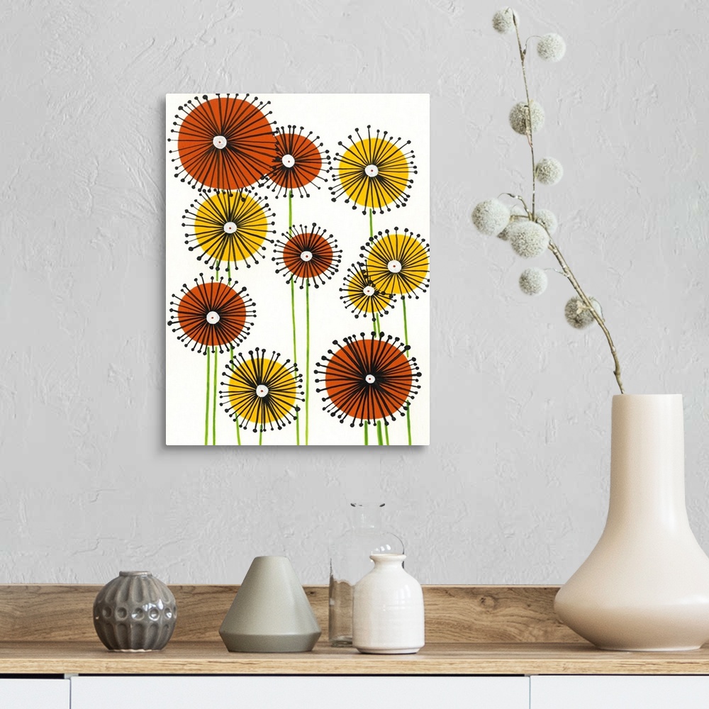 A farmhouse room featuring Vertical painting of circular yellow and orange flowers on a white background.