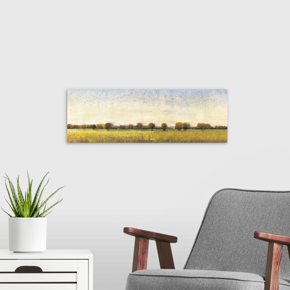 A modern room featuring Contemporary painting of a meadow with trees in the distance.