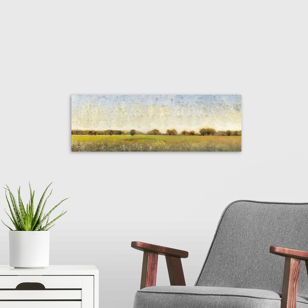 A modern room featuring Contemporary painting of a meadow with trees in the distance.