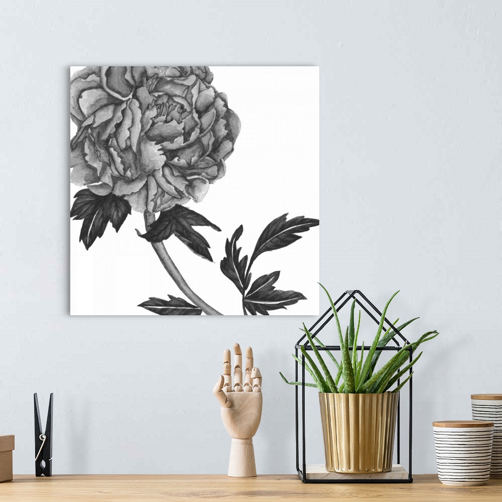 A bohemian room featuring Black and white painting of a large rose bloom on a white background.