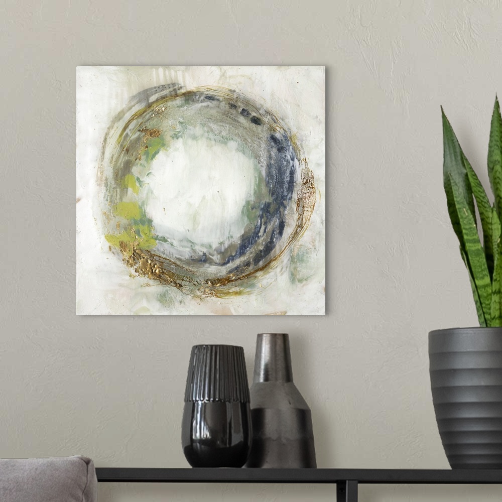 A modern room featuring Abstract artwork of a circular shape in green and blue, with a gold leaf effect.