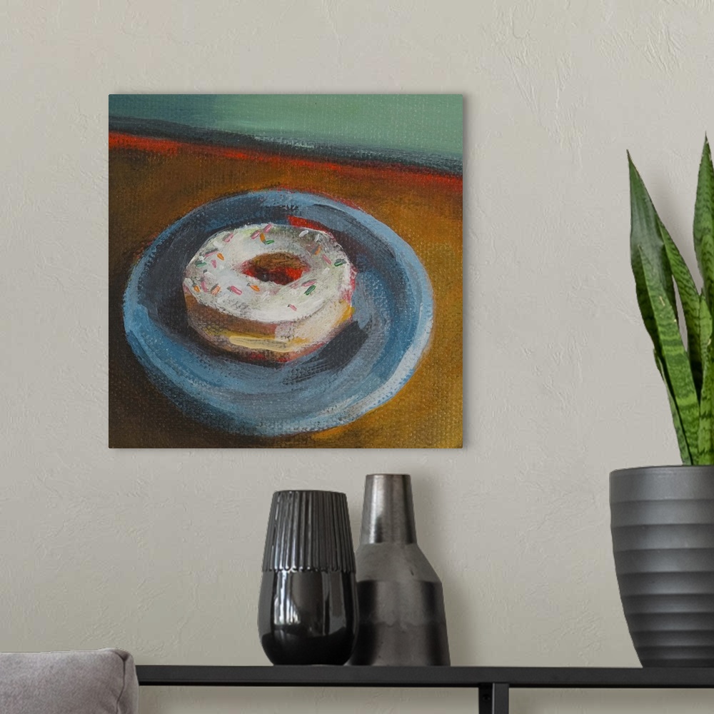 A modern room featuring Contemporary painting of a vanilla frosted donut on a blue plate.