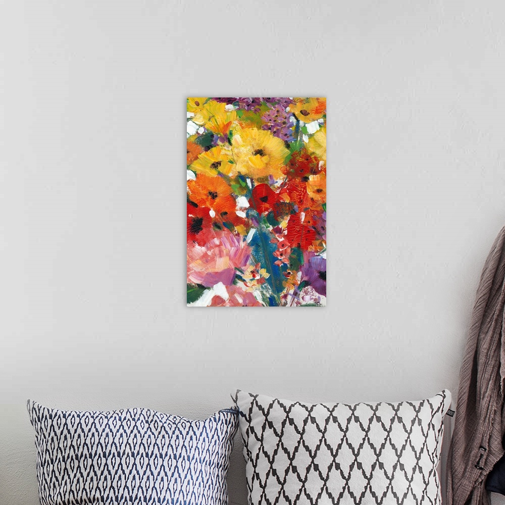 A bohemian room featuring Contemporary artwork of a rainbow colored bouquet of flowers.