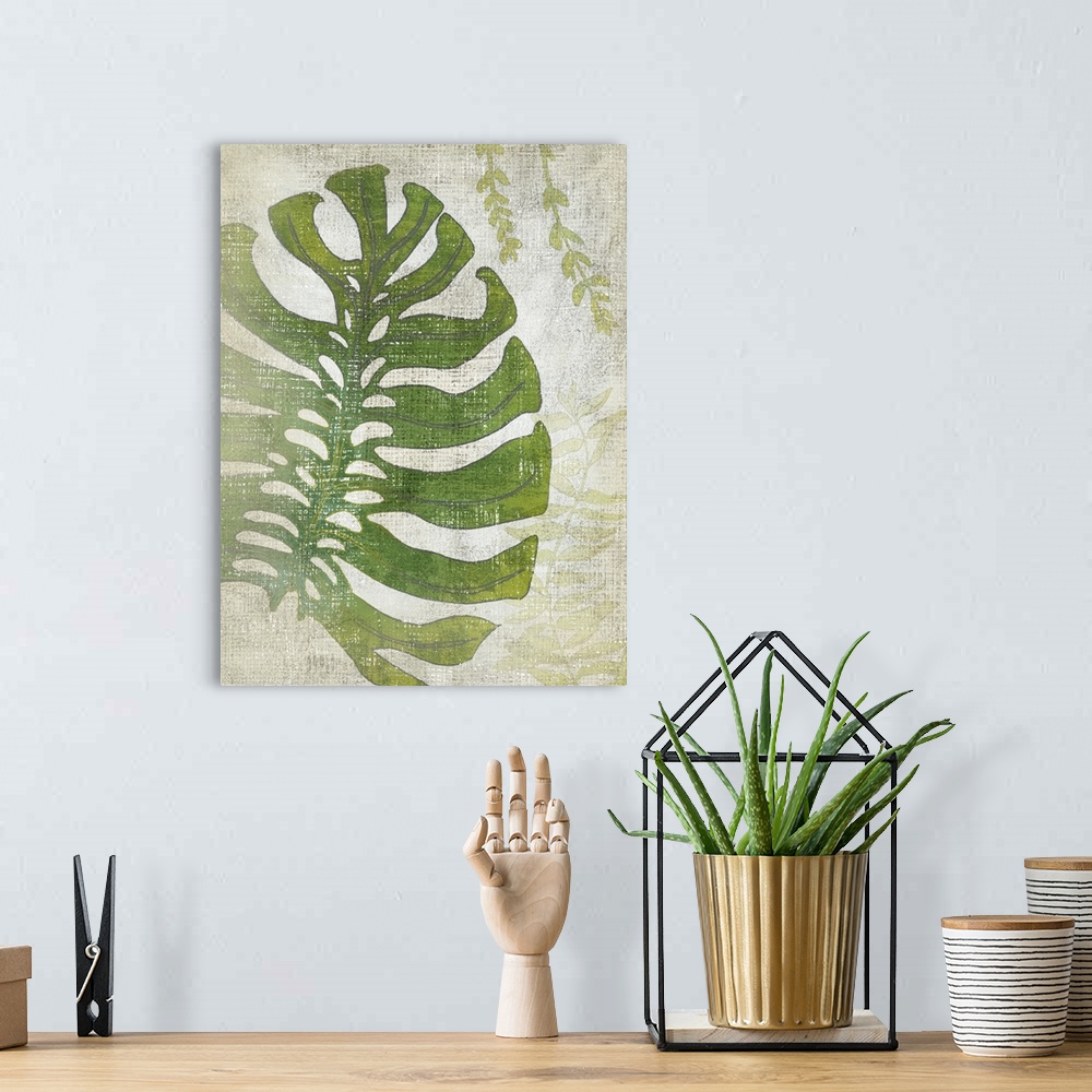 A bohemian room featuring Vertical decor with an illustrated palm leaf on a textured neutral colored background.