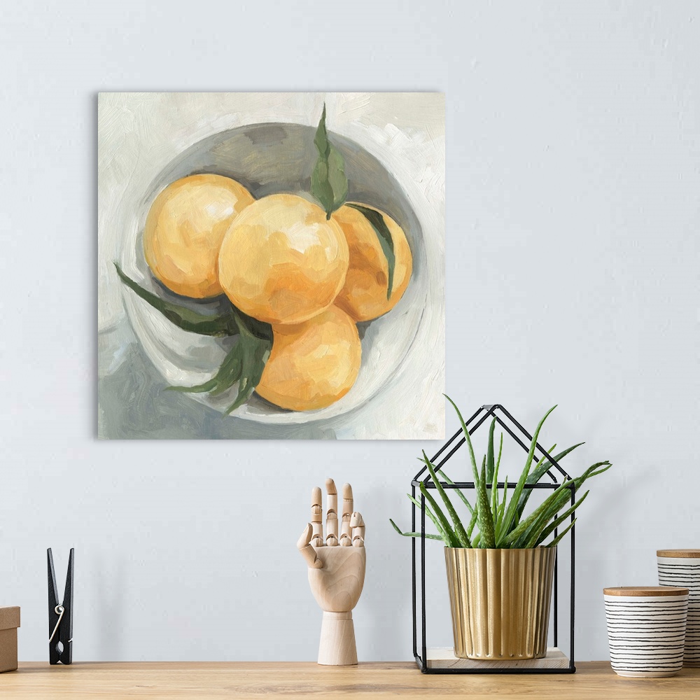 A bohemian room featuring A square contemporary painting of a gray bowl full of lemons.