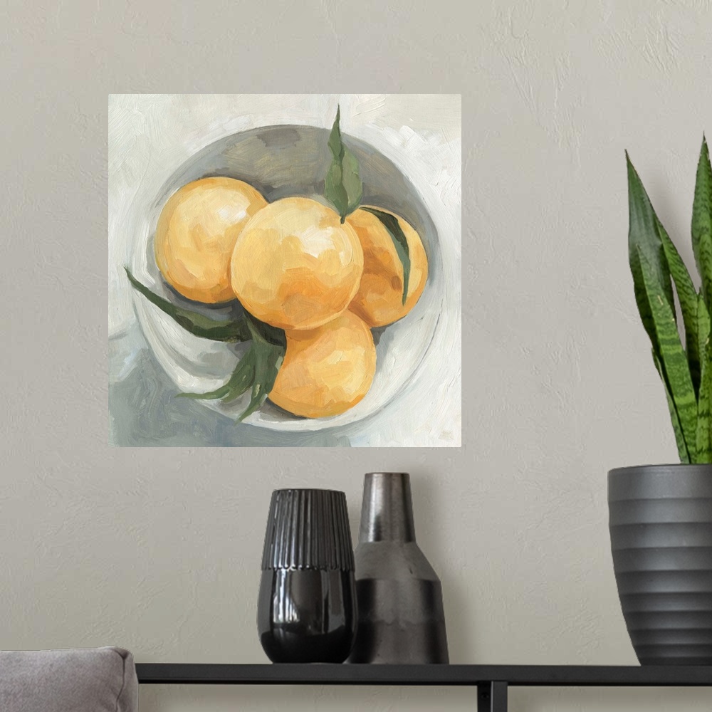 A modern room featuring A square contemporary painting of a gray bowl full of lemons.