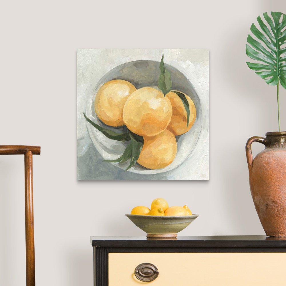A traditional room featuring A square contemporary painting of a gray bowl full of lemons.