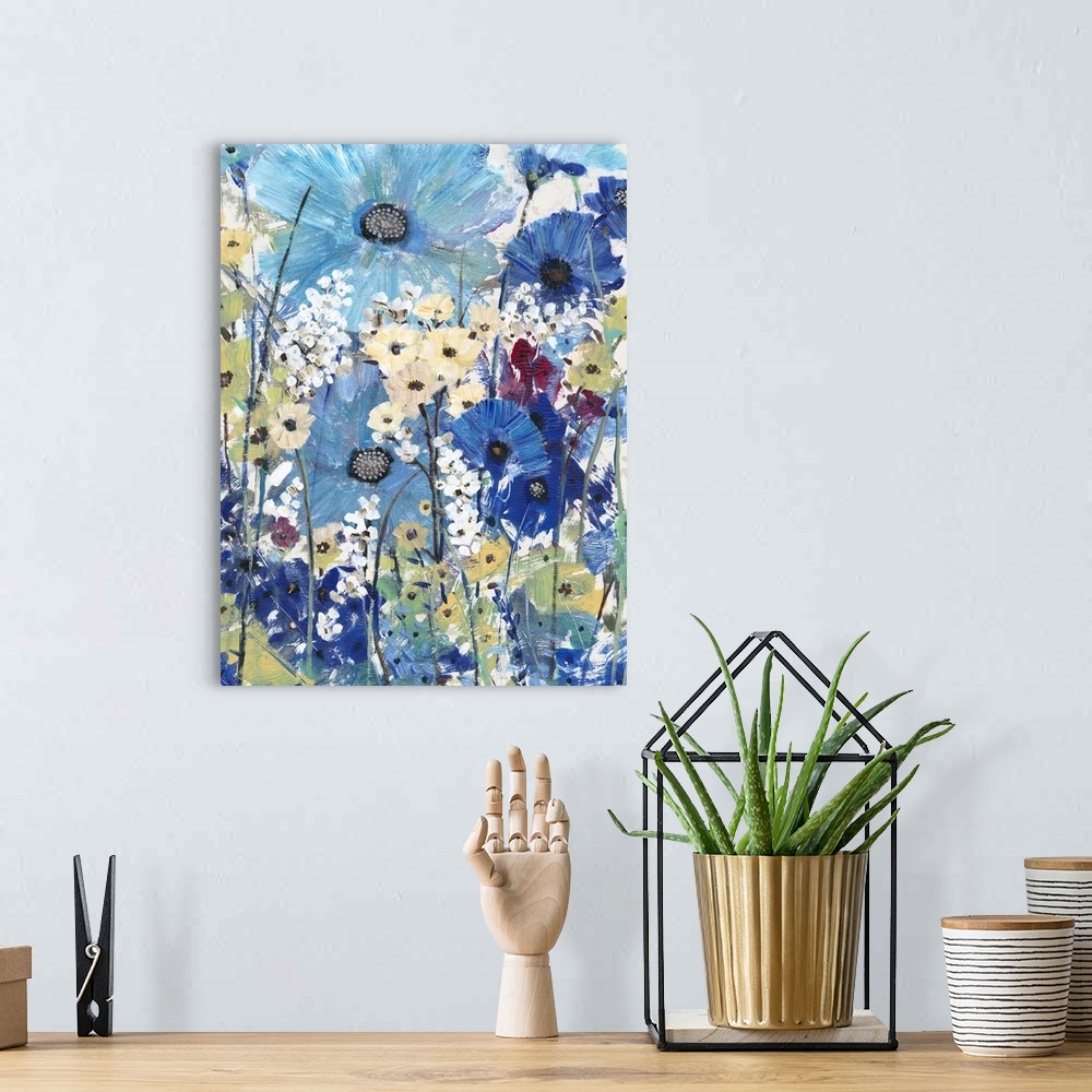 A bohemian room featuring Artistic painting of a garden of wild flowers in shades of blue, yellow and purple.
