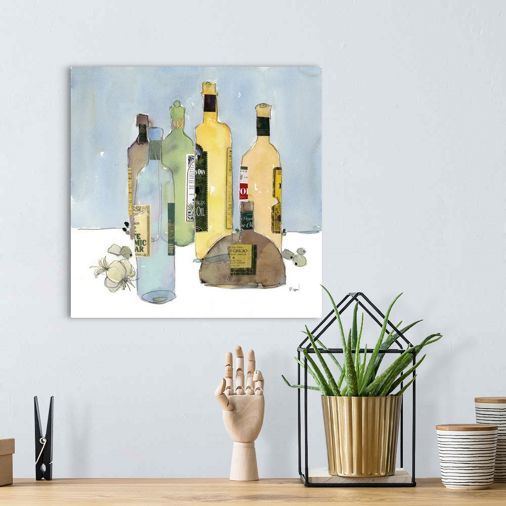 A bohemian room featuring Decorative kitchen artwork with bottles of different cooking oils and garlic and olives on the ta...