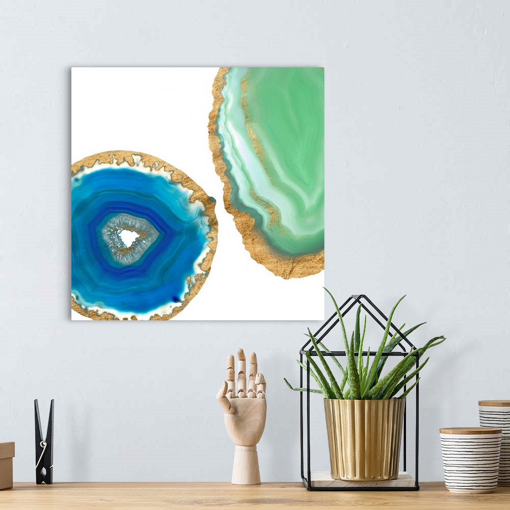 A bohemian room featuring Decorative square art with blue and green agate that has a metallic gold outline, on a white back...
