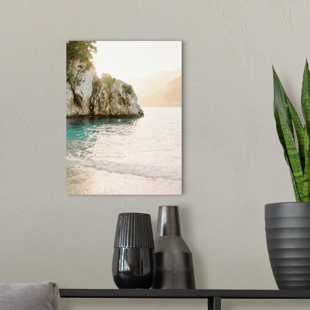 A modern room featuring Photograph of gentle waves lapping the shore of Corfu Island, Greece.