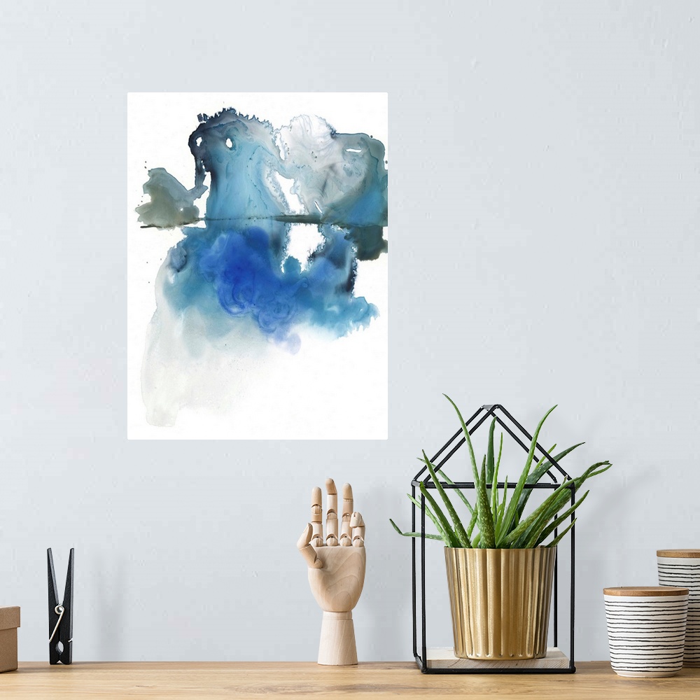 A bohemian room featuring A vertical abstract painting in blurred, blended colors of blur and gray on a white background.