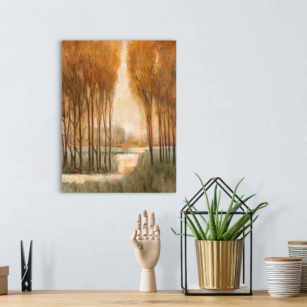 A bohemian room featuring A painting looking through a narrow arch to a clearing in a forest.