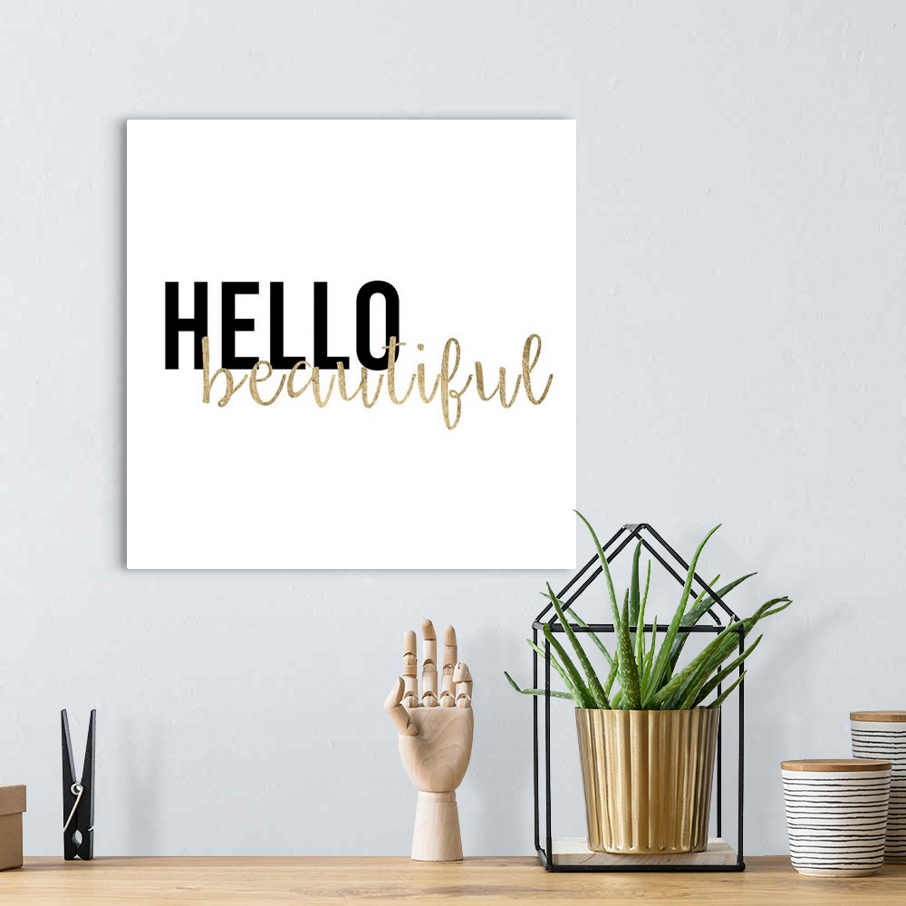 A bohemian room featuring "Hello beautiful" in black and gold text on white.