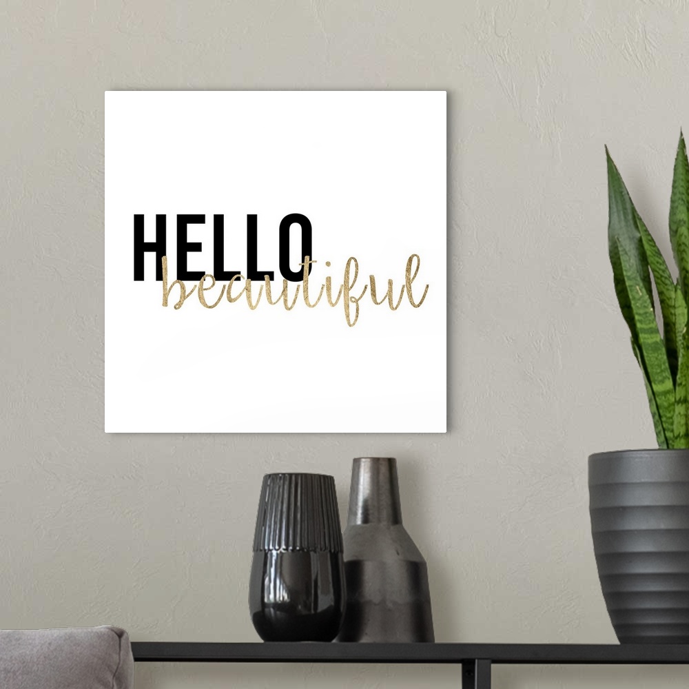 A modern room featuring "Hello beautiful" in black and gold text on white.
