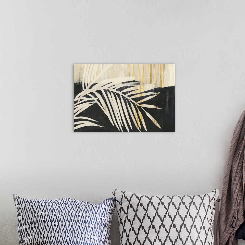 A bohemian room featuring Horizontal artwork of large palm leaves in beige tones with gold accents on black.