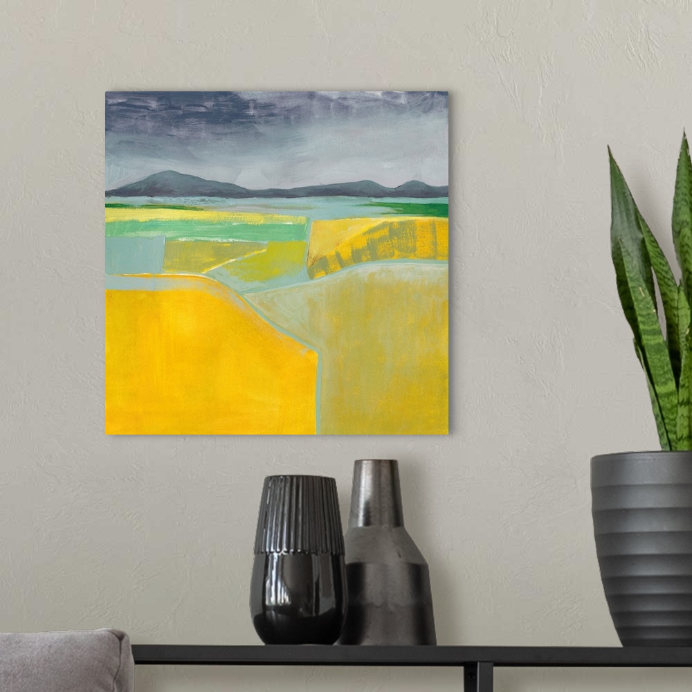 A modern room featuring Abstract landscape painting using vibrant yellow in the foreground of the image.