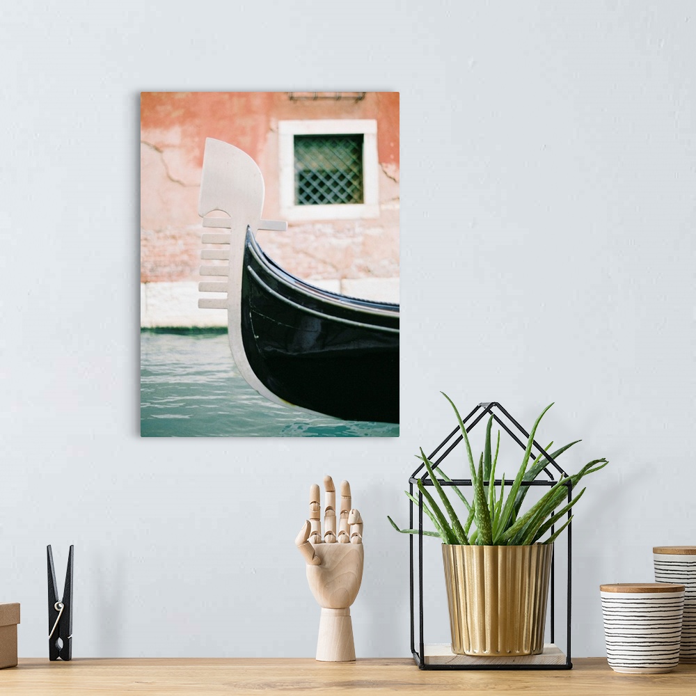 A bohemian room featuring Photograph of the decoration on the end of a gondola on a canal in Venice, Italy.