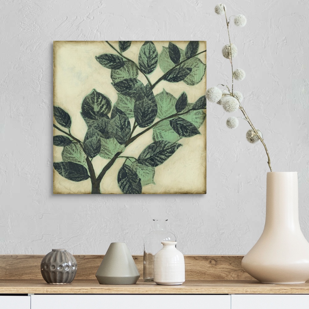 A farmhouse room featuring Home decor artwork of muted green leaves on a twig against a light pale green background.