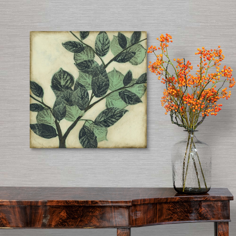 A traditional room featuring Home decor artwork of muted green leaves on a twig against a light pale green background.