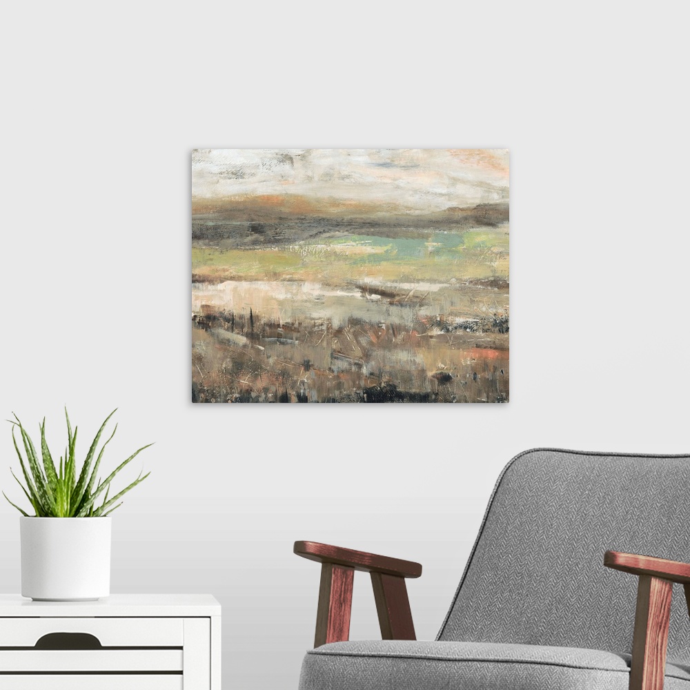 A modern room featuring An abstract landscape painting of a field done if textured tones of brown, green and cream.