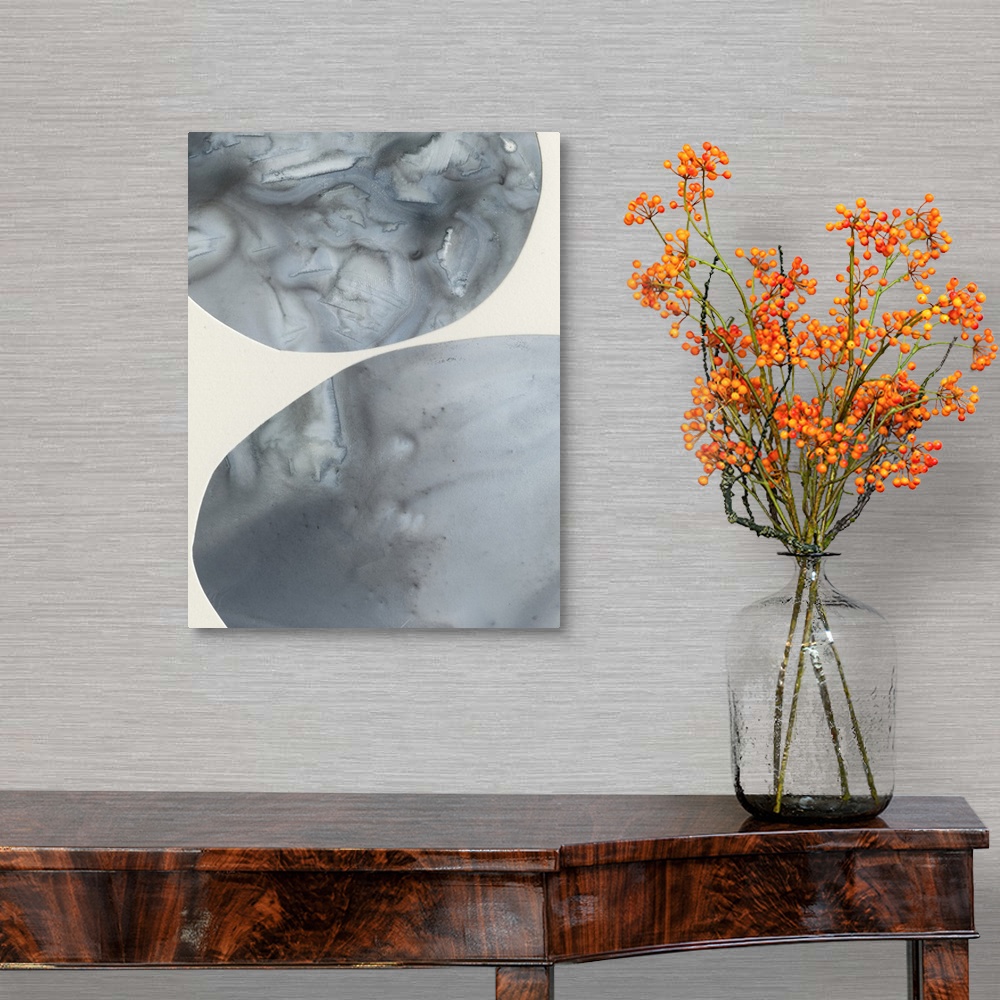 A traditional room featuring Abstract painting of circular shapes done in a marble effect of blended colors.