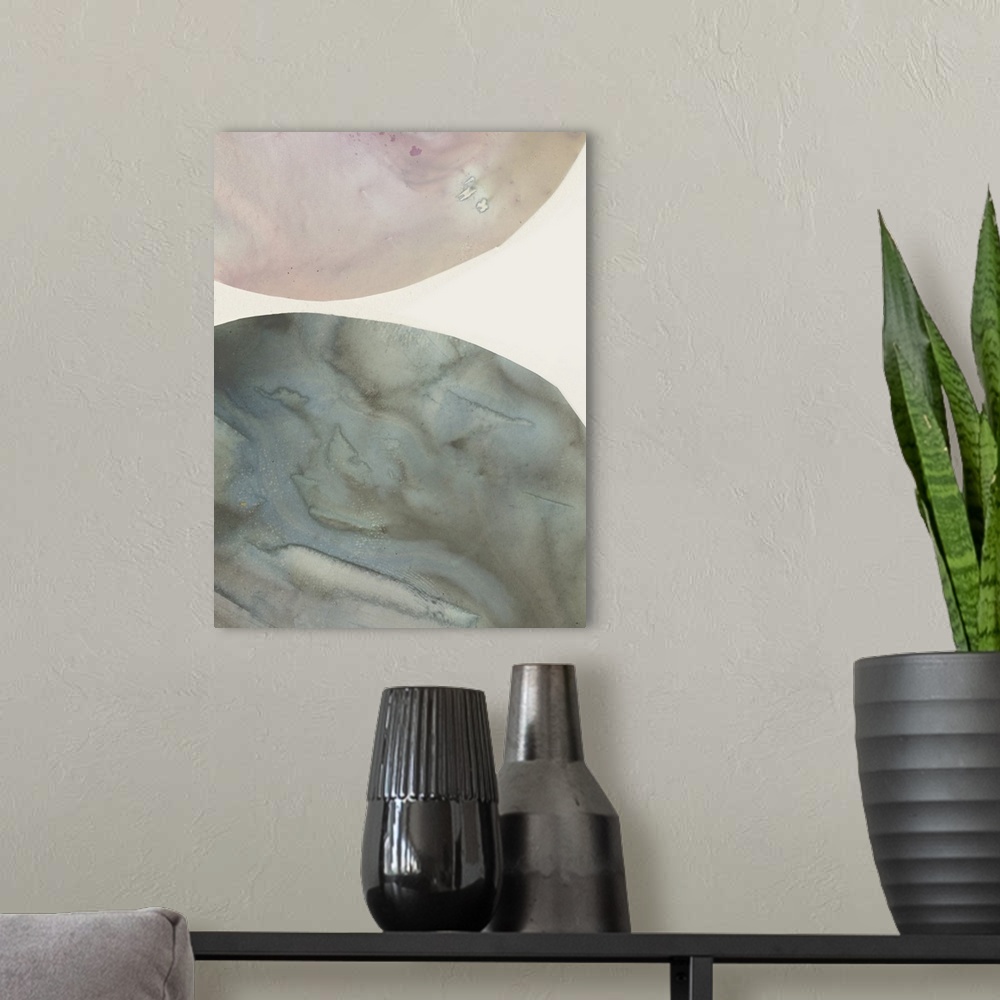 A modern room featuring Abstract painting of circular shapes done in a marble effect of blended colors.